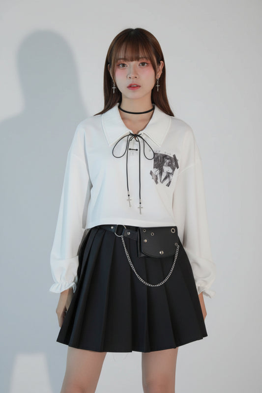 Women’s white cropped long-sleeve top with contrast cord and graphic detail