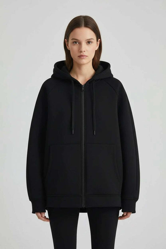 Women wearing Veloran oversized zipper hoodie coat with hood and pockets in casual streetwear style