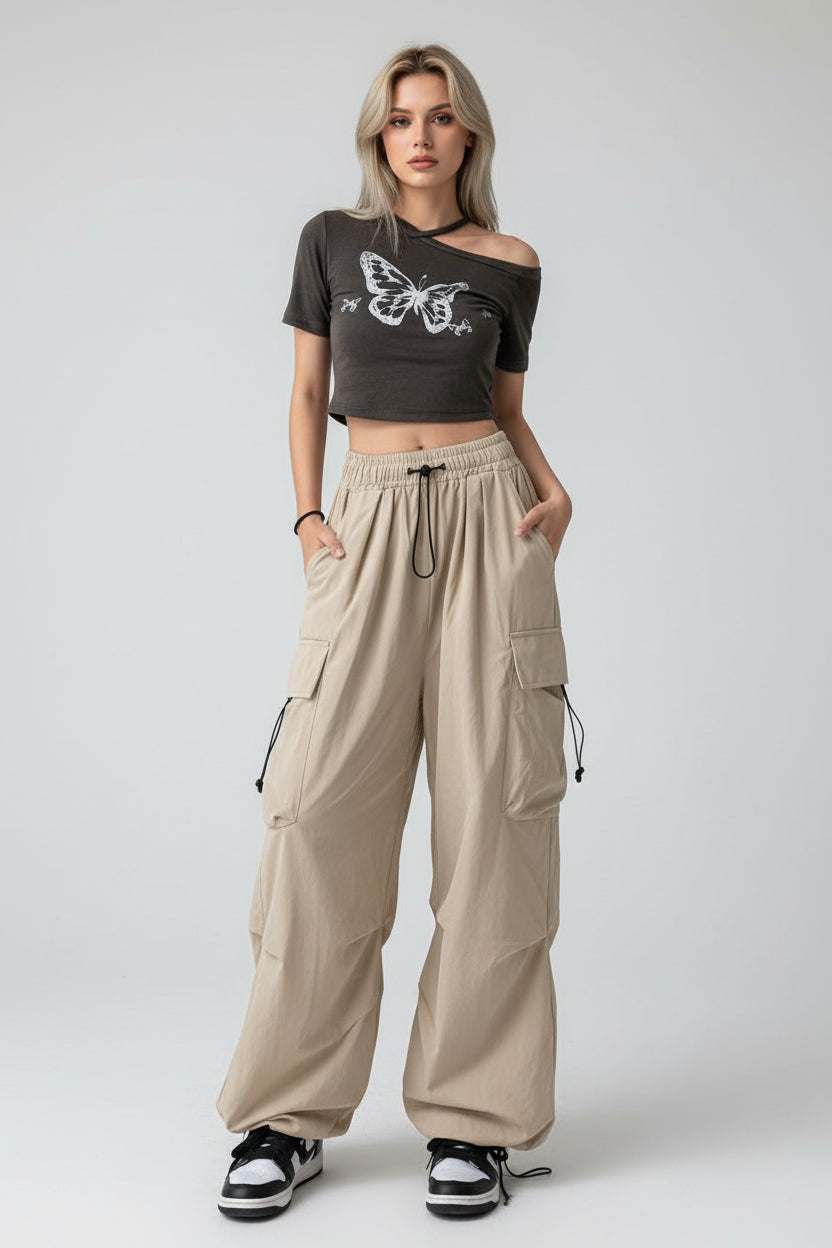 Woman wearing high-waist wide-leg trousers in a relaxed fit, styled for modern comfort and elegance