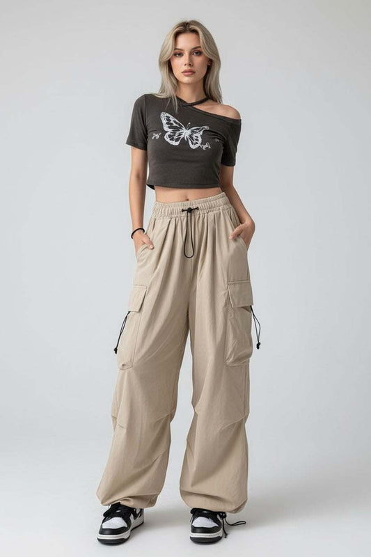 Woman wearing high-waist wide-leg trousers in a relaxed fit, styled for modern comfort and elegance