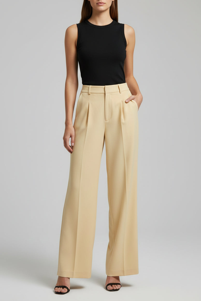 Model wearing soft yellow wide-leg pants
